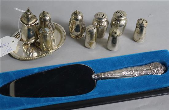 Five assorted silver condiments, four plated condiments and a small tray and a silver handled cake knife.